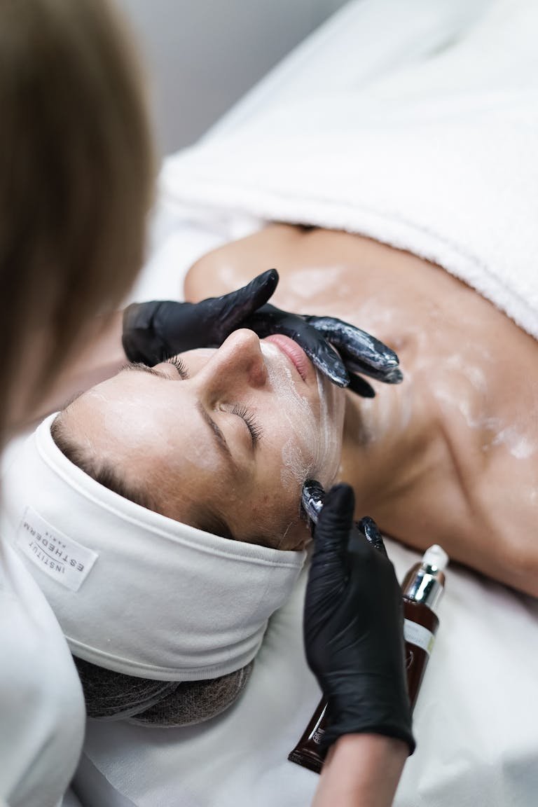 A Beauty Tips – Well Health Organic.com Skin Care in Hindi Wellhealthorganic relaxing skincare session with a woman receiving a facial treatment at a spa.