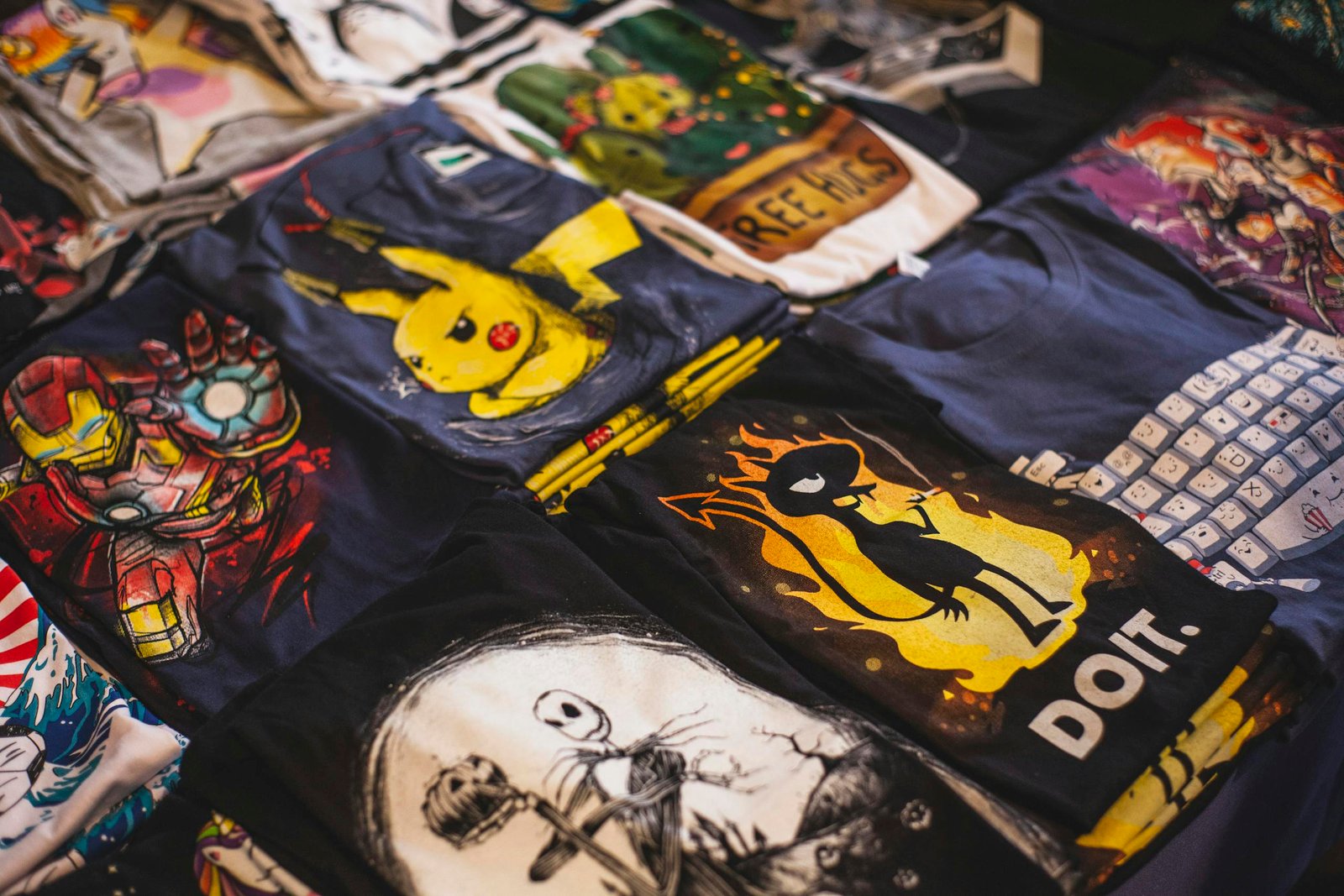 A vibrant Polo Shirts assortment of graphic t-shirts featuring popular characters displayed in a market setting.
